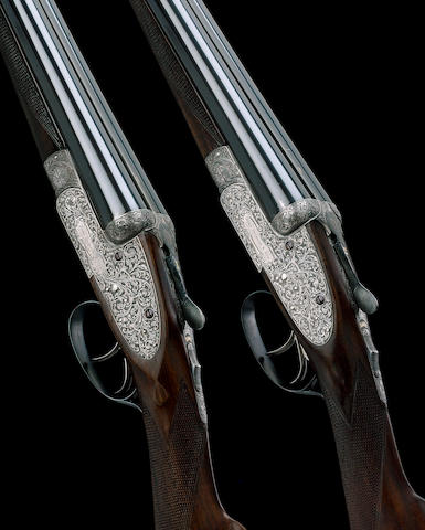 A FINE PAIR OF SUMNER-ENGRAVED 12-BORE SIDELOCK EJECTOR GUNS BY J. DICKSON, NO. 6687/8 In their leather case with a leather-mounted canvas outer cover