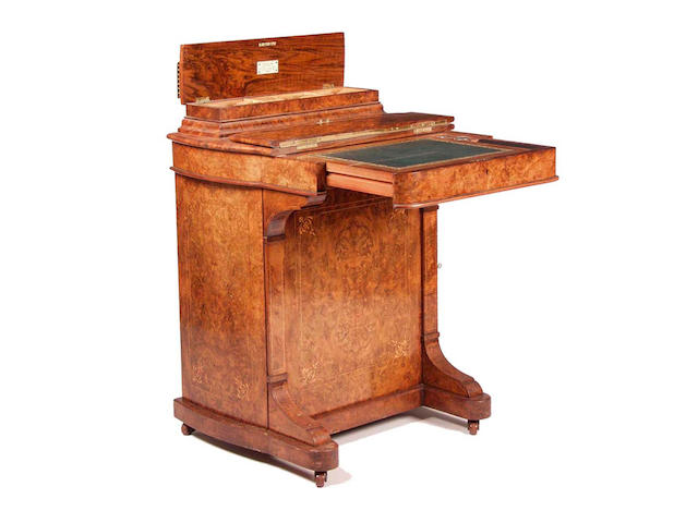 A mid Victorian walnut Davenport,by Rough and Son, London