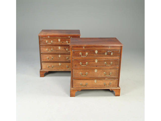 A pair of 20th century George III style mahogany chests of drawers