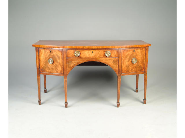 A George III mahogany and crossbanded bowfront sideboard