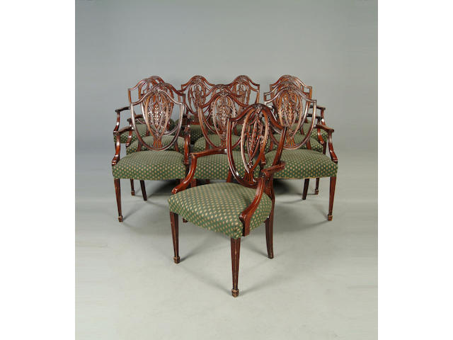 A set of fifteen mahogany shield back dining chairs