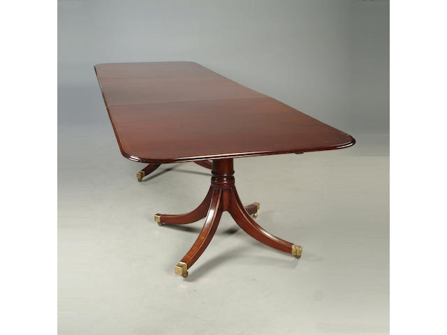 A Regency style mahogany four pedestal dining table