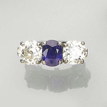 A sapphire and diamond three-stone ring