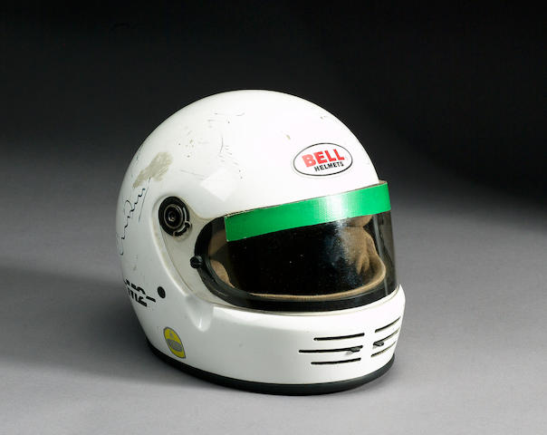 A Bell helmet signed by nine drivers and team members,