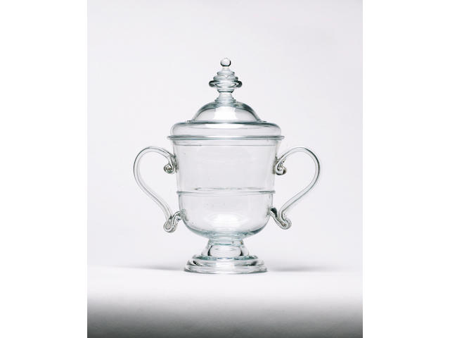 An important glass handled cup and cover circa 1715-30