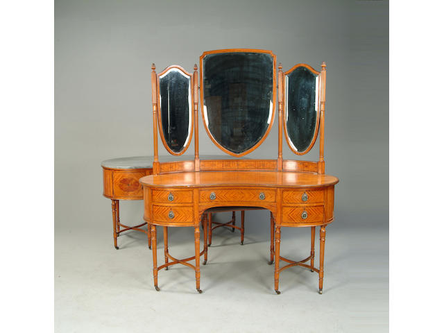 An early 20th century satinwood kidney shaped dressing table