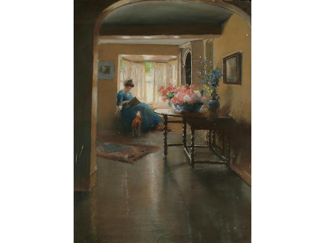 Frank Dean (British, 1865-1946) A lady reading on a window seat, 60 x 45 cm.