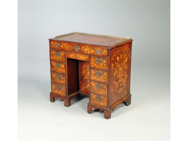 A mid 18th century mahogany and later floral marquetry inlaid kneehole desk