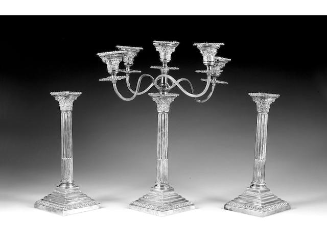 A pair of silver Corinthian column candlesticks and five-light candelabrum en suite, by Fergenbaum & Son, Birmingham 1946,