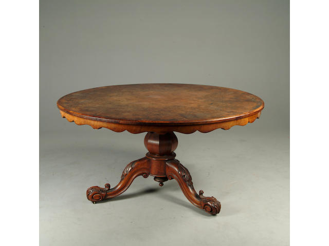 A Victorian walnut breakfast table