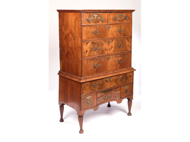 A George I walnut and feather-banded Chest on Stand,