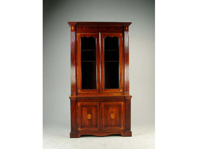 A late Victorian mahogany and fan inlaid bookcase
