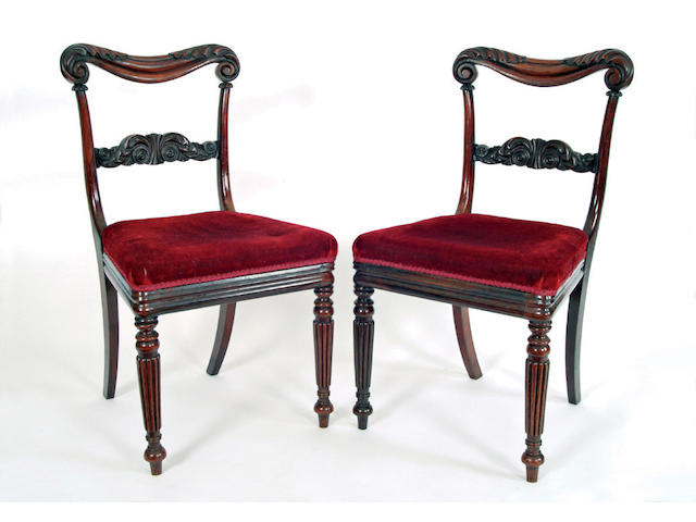 A set of twelve George IV rosewood dining chairs
