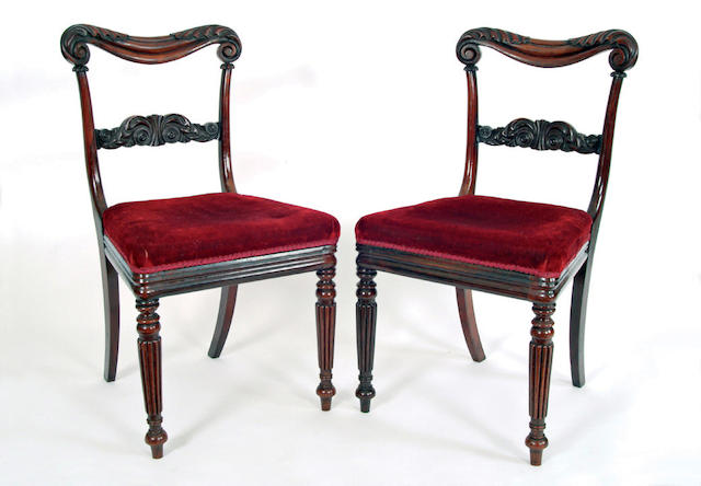 A set of twelve George IV rosewood dining chairs