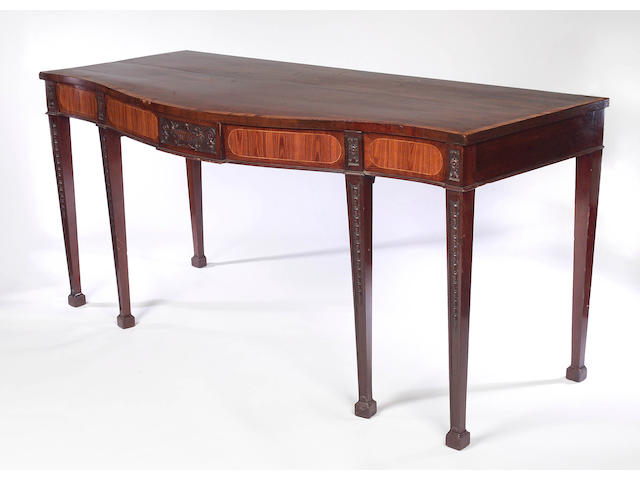 A late 19th century mahogany, rosewood and gonzalo alves inlaid serpentine Serving Table,