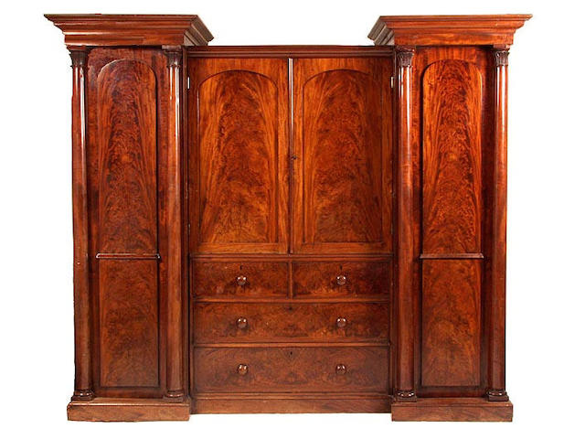 A mid Victorian mahogany triple wardrobe,