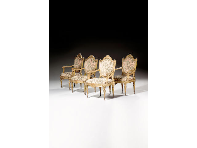 A set of four late 18th Century Italian carved giltwood Fauteuils,