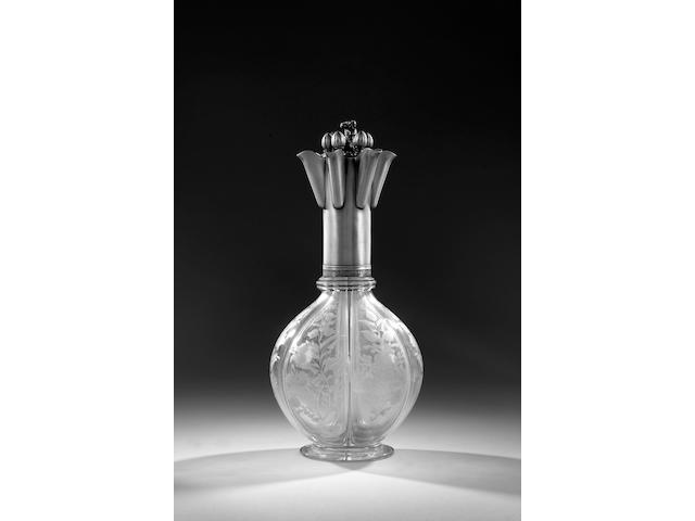 An unusual Russian silver-mounted six compartment glass decanter, Maker's mark TH probably for Togan