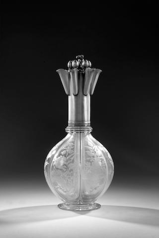 An unusual Russian silver-mounted six compartment glass decanter, Maker's mark TH probably for Togan