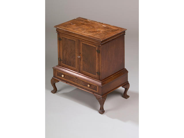 A reproduction George I style walnut miniature cabinet on stand,