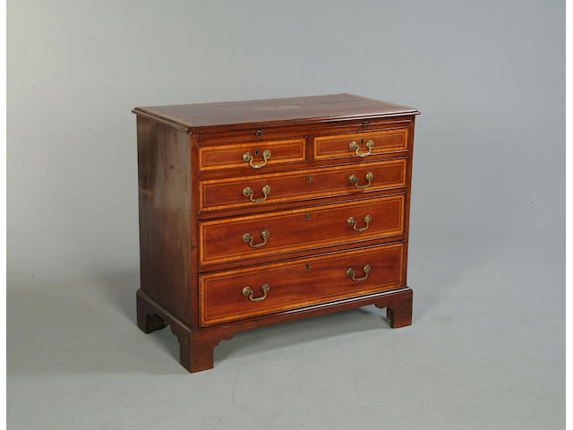 A George III mahogany and satinwood crossbanded chest