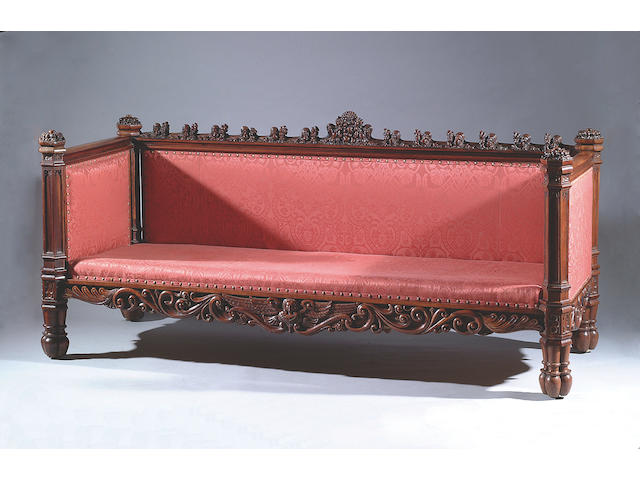 A Victorian carved mahogany gothic sofa, in the manner of Richard Bridgens,