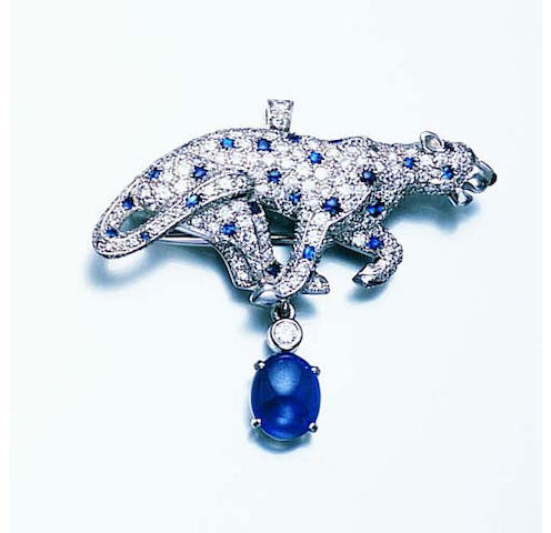 A sapphire and diamond brooch/pendant by Cartier