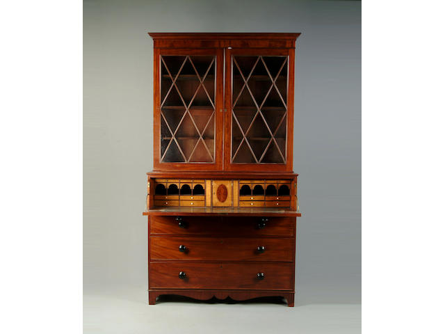 An early 19th century mahogany secretaire bookcase