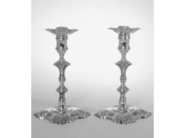 A pair of George II cast candlesticks by John Cafe, London 1750,