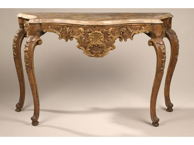 A pair of 18th Century Italian console tables of serpentine outline,
