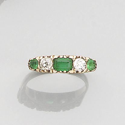 An emerald and diamond half-hoop ring
