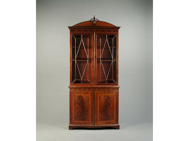 An Edwardian mahogany and marquetry inlaid bookcase