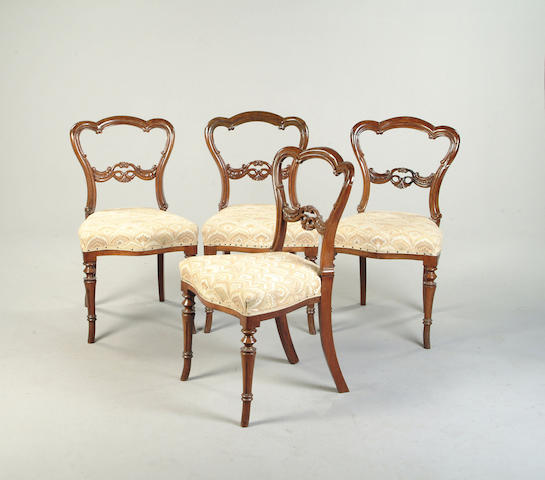 A set of four Victorian rosewood balloon back dining chairs