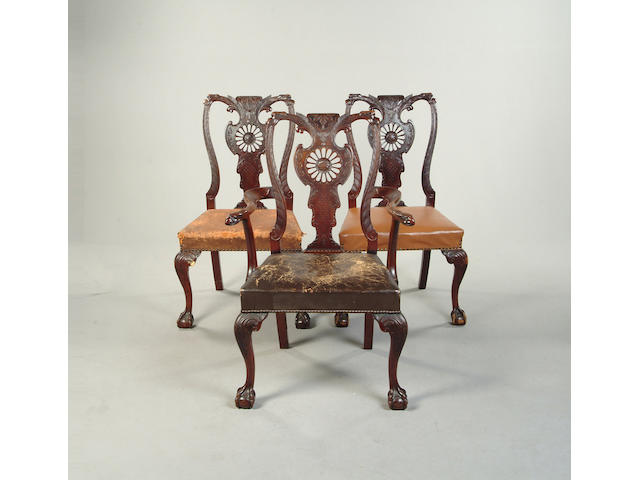 A set of three mid 18th century style carved mahogany dining chairs