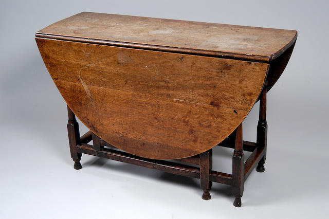 An 18th Century oak gate-leg table,