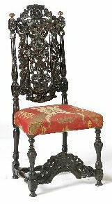An 18th Century Continental carved walnut and oak high back chair,