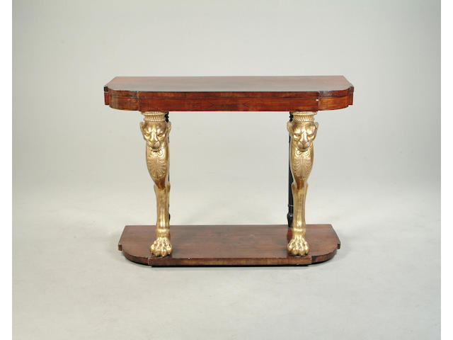 A Regency style mahogany and parcel gilt console table
