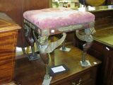 An Empire style ormolu mounted dressing stool,
