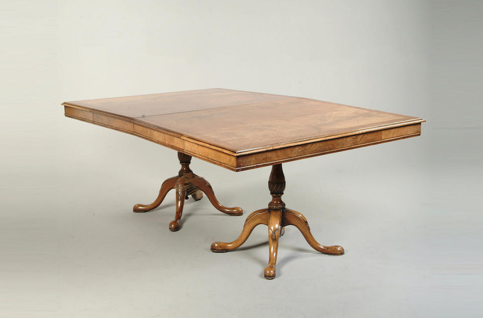 A Georgian style walnut dining table