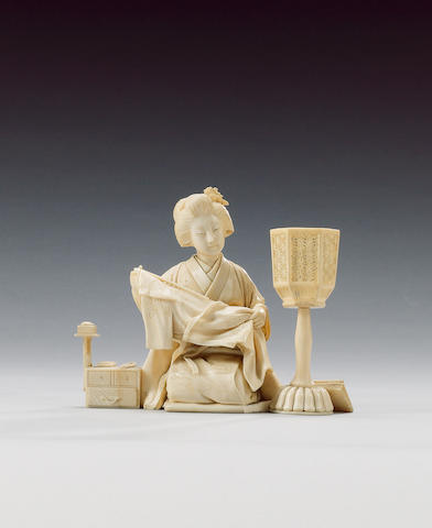 An elegant ivory okimono of a kneeling Yamato Nadeshko,
