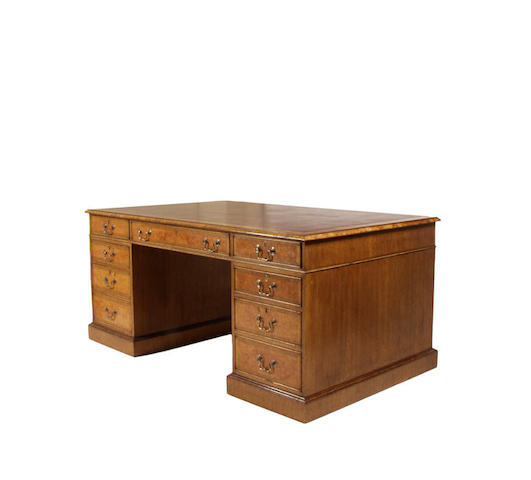 An early 20th Century mahogany and elm veneered partners desk
