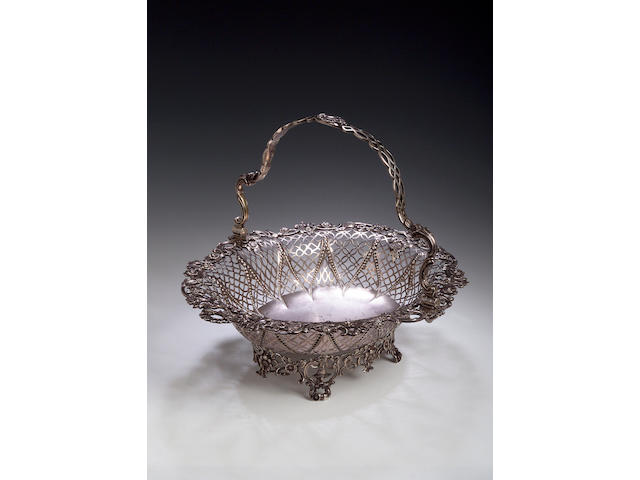 A George III silver cake basket, by William Plummer, London 1763,