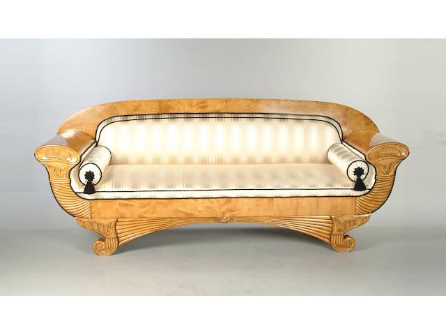 A 19th century Biedermeier satin birch sofa