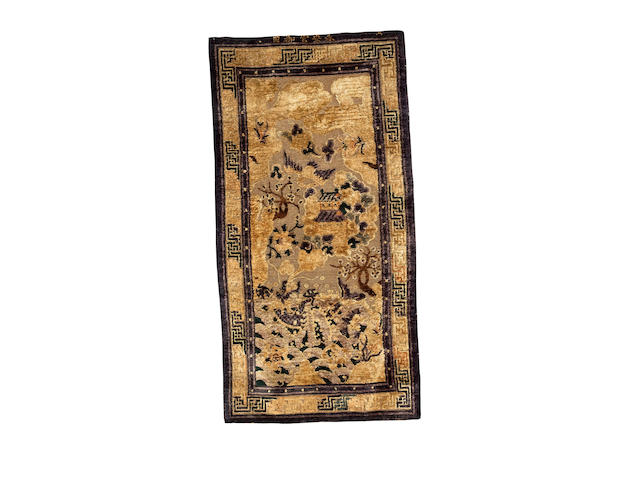 A pair of Chinese silk and metal thread rugs, each approx. 185cm x 93cm inscription at each end