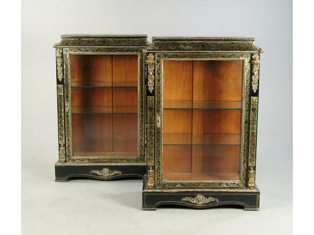 A pair of 19th century French, brass inlaid and gilt metal mounted pier cabinets