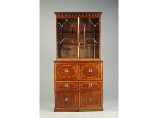 A George III mahogany and tulipwood banded secretaire bookcase