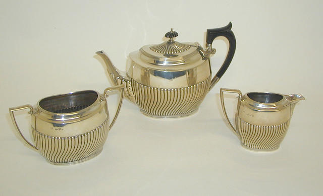 A late Victorian three piece tea set, by Charles Boyton, 1894,