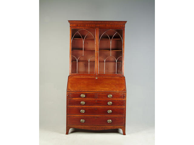 A George III mahogany and boxwood strung bookcase