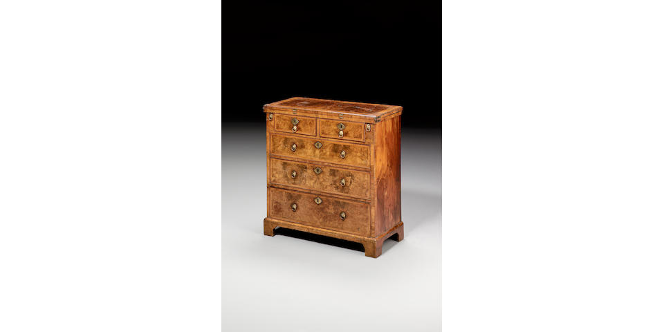 A George I burr walnut, walnut crossbanded and feather banded Bachelors Chest,