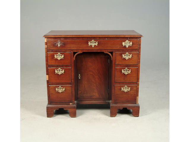 An early George III mahogany kneehole desk